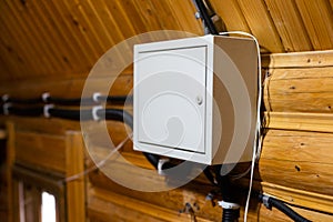 automatic fuses in electricity distribution box (fusebox) inside wooden house