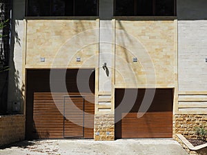 Automatic garage gate and front door in a private apartment building in a modern style