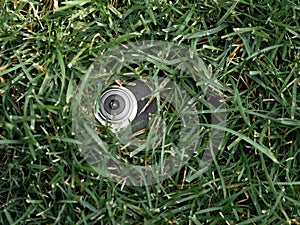 Automatic Garden Lawn sprinkler on a background of grass.