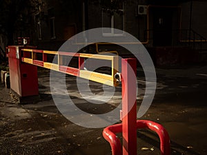 Automatic gate barrier. Tinted image. Typical city development