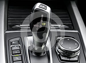 Automatic gear stick of a modern car. Car interior details. Transmission shift