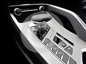 Automatic gear stick of a modern car. Modern car interior details. Close up view. Car inside. Automatic transmission lever shift.