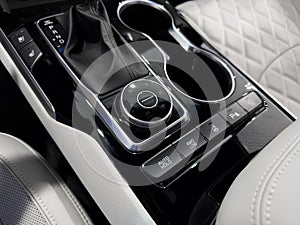 Automatic gear stick of a modern car. Modern car interior details. Close up view. Car inside. Automatic transmission lever shift.