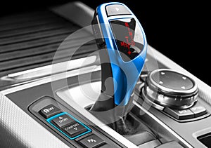 Automatic gear stick of a modern car. Modern car interior details. Close up view. Car detailing. Automatic transmission lever shif