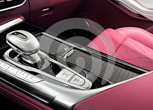 Automatic gear stick of a modern car. Modern car interior details. Close up view. Car inside. Automatic transmission lever shift.