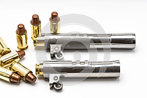 Automatic handgun barrels and .45 bullets on white background , Semi wadcutter bullets