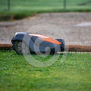 Automatic lawn mower at work