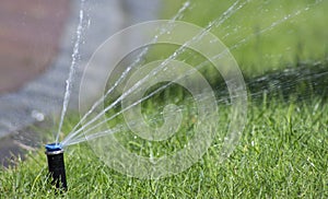 Automatic lawn watering system. Automatic watering sprinkler
