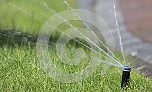 Automatic lawn watering system. Automatic watering sprinkler