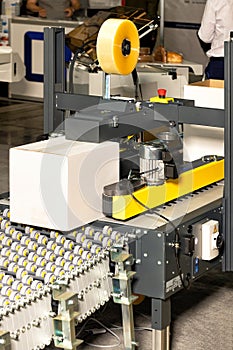 Automatic line for packaging various products on a conveyor