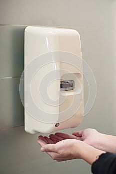 Automatic liquid soap dispenser on wall