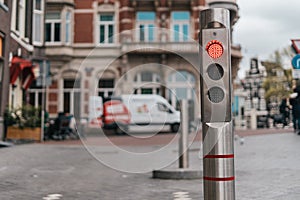 Automatic metallic bollard with red light