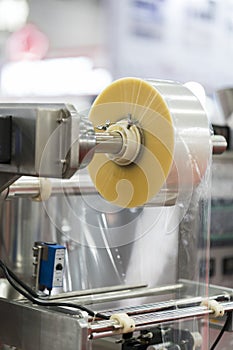 Automatic packing machine with plastic bag and paper box