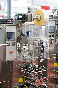 Automatic packing machine with plastic bag and paper box