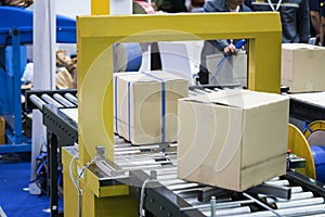 Automatic packing machine with plastic bag and paper box