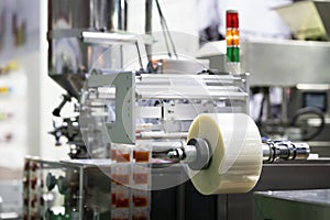 Automatic packing machine with plastic bag and paper box