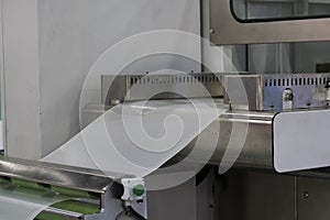 Automatic packing machine with plastic bag and paper box