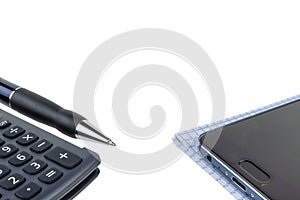 Automatic pen, calculator, notebook, phone on a white background close-up.