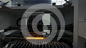Automatic pick and place machine is installing components on circuit board. Creative. Assembly line on electronics and
