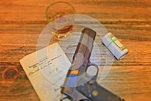 Automatic pistol with antique document and whiskey.