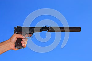 Automatic pistol in a hand