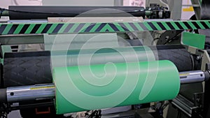 Automatic plastic bag making machine - roller with green polyethylene film