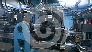 Automatic punching line. The powerful machine punches holes in the steel sheet.