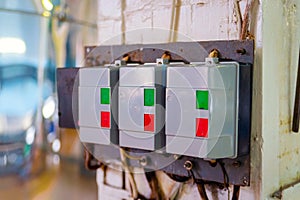 Automatic push-button switches of network equipment of three-phase network installed on the wall in the scientific and industrial