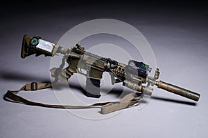 Automatic rifle with silencer and laser sight