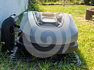 automatic robot lawn mower. The lawnmower is charging.