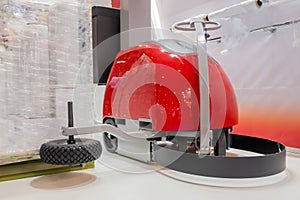 Automatic robotic pallet wrapper during work at exhibition