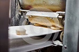 Automatic roti making machine at Gurudwara Bangla Sahib temple, automatic cooking of chapati