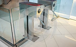 Automatic silver metallic security turnstile station