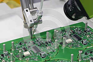 The automatic soldering robot operation with PCB board