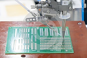 The automatic soldering robot operation with PCB board