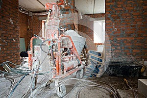 Automatic Spray Plastering Machine for Plastering Walls efficiently on Building of an apartment house
