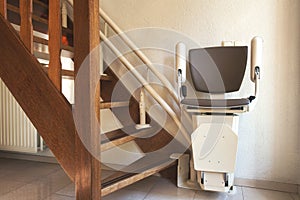 Automatic stairlift on staircase for elderly or disability in a house,