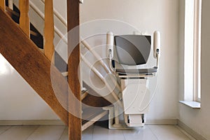 Automatic stairlift on staircase for elderly or disability in a house, photo