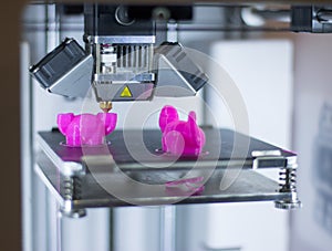 Automatic three-dimensional 3d printer performs product creation. 3d printing and automatic robotic technology, close-up