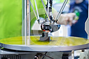 Automatic three-dimensional 3d printer performs product creation. 3d printing and automatic robotic technology, close-up