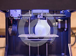 Automatic three-dimensional 3d printer performs product creation. 3d printing and automatic robotic technology, close-up