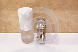 Automatic touchless foam foap dispenser in bathroom