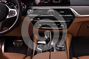 Automatic transmission in luxury car. Interior detail.
