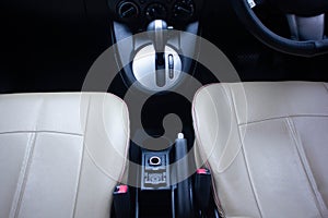 Automatic transmission shift selector in the car interior. Closeup a manual shift of modern car gear sifter.