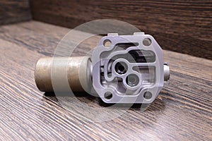 Automatic transmission solenoid on wooden background