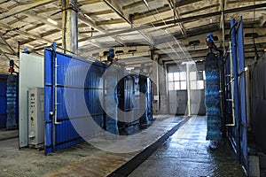 Automatic tunnel car wash brushes, control panel and gates ready for work at the trolley bus depot