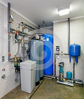 Automatic water treatment system with sensors and reservoirs photo