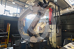 Automatic welding robot mechanical arm is working in the modern automobile parts factory.