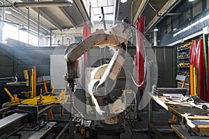 Automatic welding robot mechanical arm is working in the modern automobile parts factory.