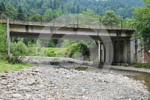 Automobile bridge over small river in the Ukraine